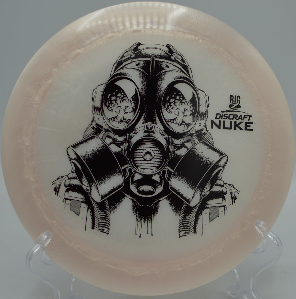 Discraft Big Z Nuke streaking across an open field on a powerful backhand at Maple Hill Disc Golf Course in Leicester, Massachusetts.