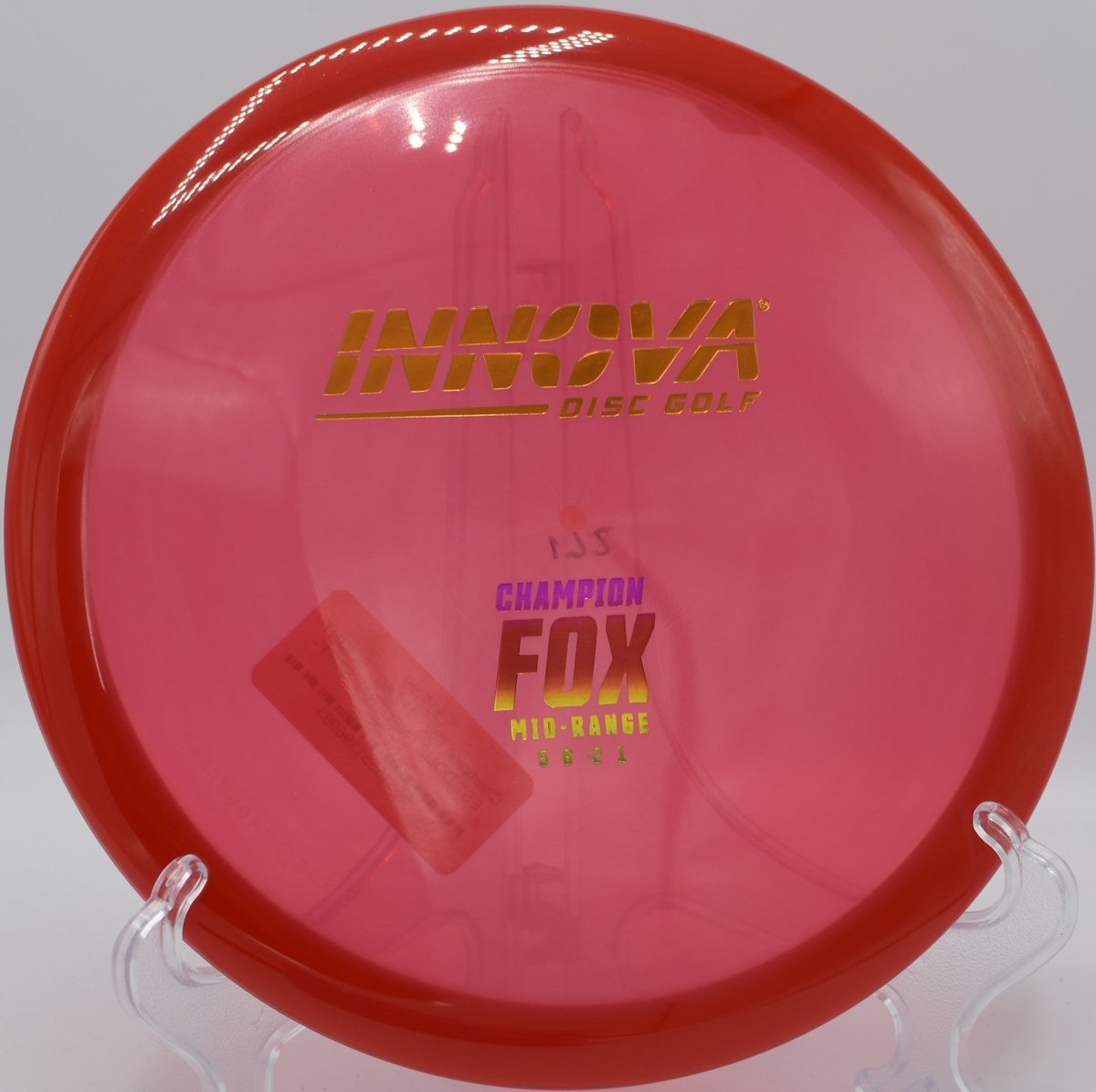 Champion Fox midrange resting in fairway grass after a glidey straight approach at Willow Creek Disc Golf Course in Sunnyvale, California