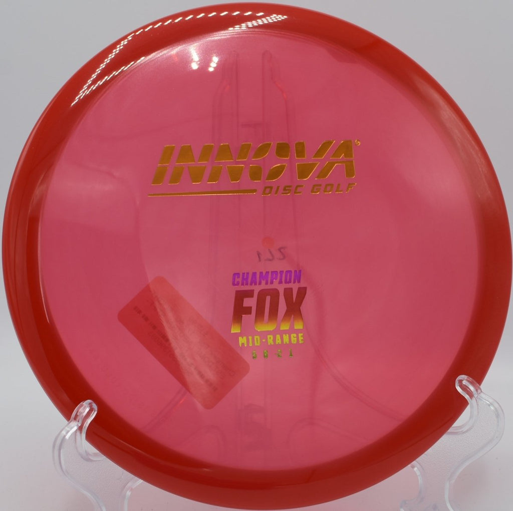 Champion Fox midrange resting in fairway grass after a glidey straight approach at Willow Creek Disc Golf Course in Sunnyvale, California