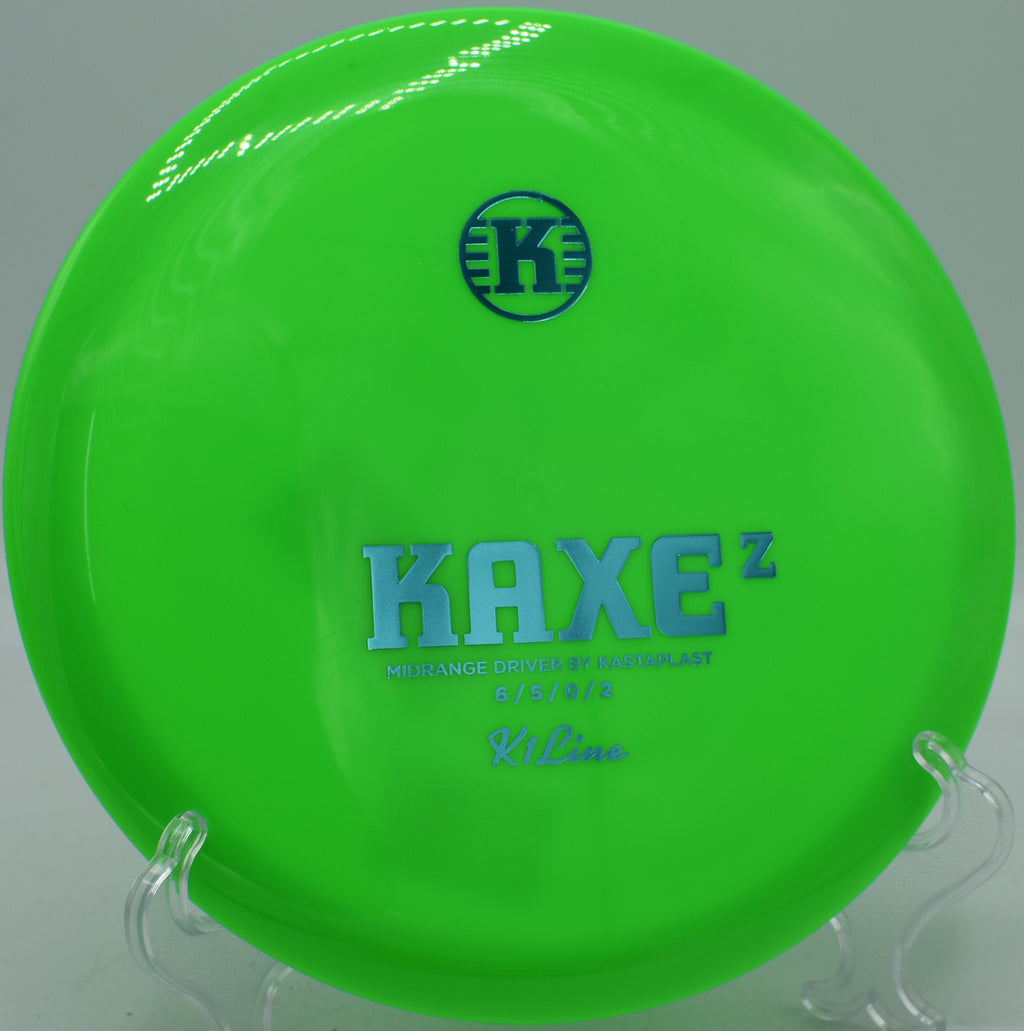 K1 Kaxe Z Kastaplast disc threading wooded gaps at Blue Ribbon Pines Disc Golf Course in East Bethel, Minnesota.