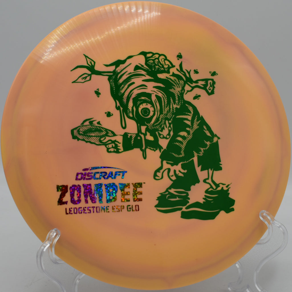Stable ESP Glo Zombee mid-flight on a tunnel shot at The Fort Disc Golf Course in Ogden, UT.