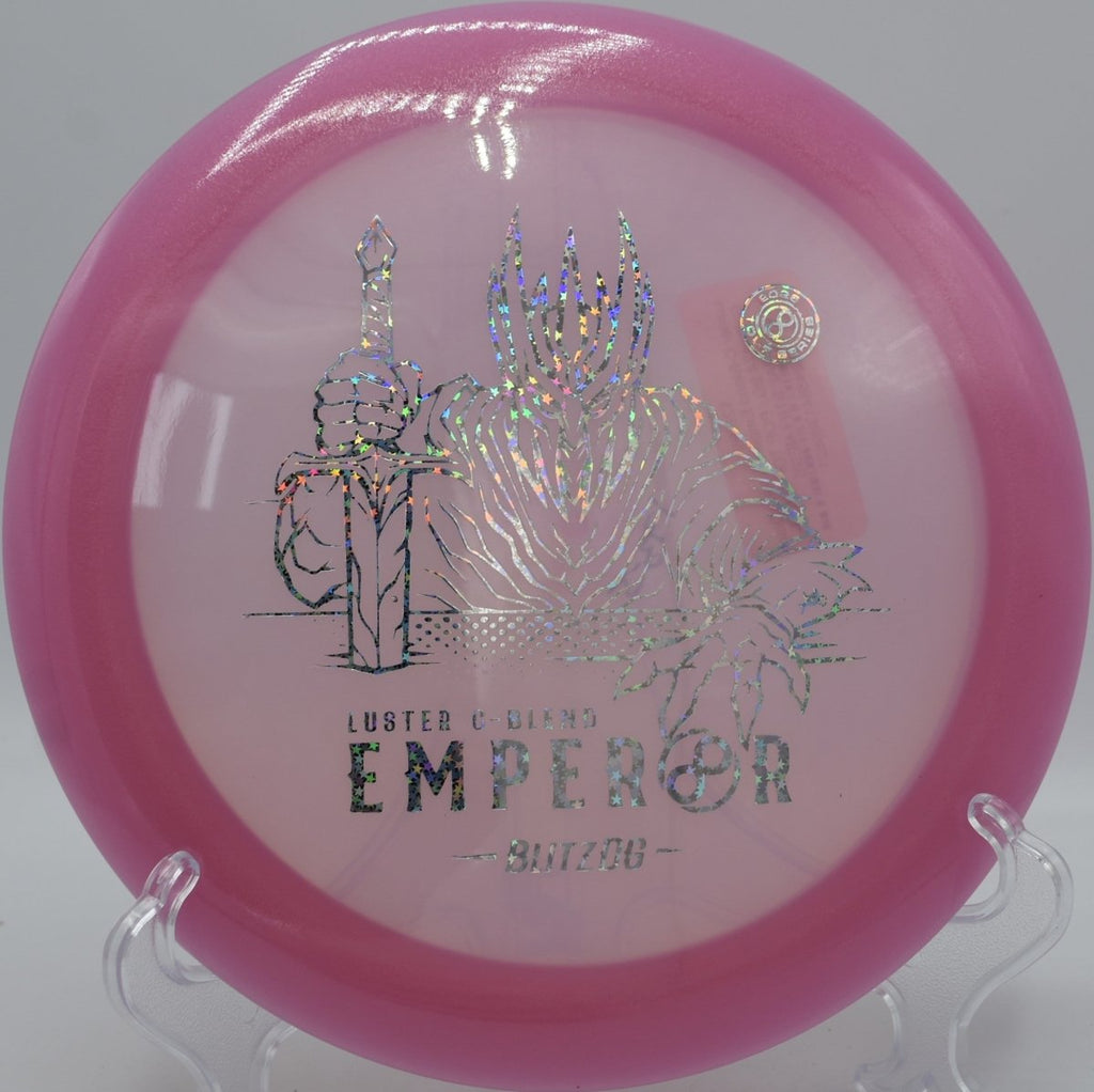 Luster C-Blend Emperor driver resting in fairway grass after a max distance shot at Persimmon Ridge Disc Golf Course in Greenbrier, Arkansas