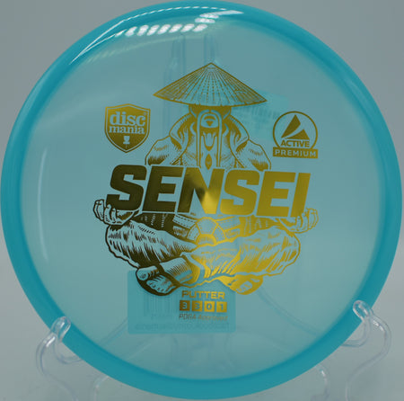 Discmania Premium Sensei approach shot landing softly near the pin at Morley Field Disc Golf Course in San Diego, California.