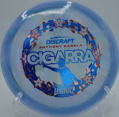 Discraft Z-Swirl Cigarra positioned on a turf tee at East Roswell Park DGC in Roswell, GA, ideal for shaping tight woods shots.