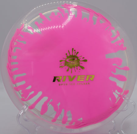 River in Opto-Ice Splash plastic parked by the basket at Idlewild Disc Golf Course in Burlington, Kentucky, perfect for understable fairway drives and shaping lines.

