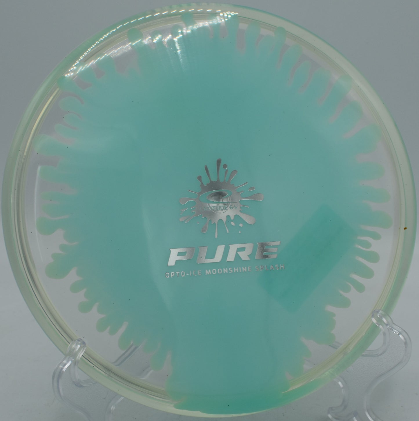 Glow-in-the-dark Moonshine Splash Pure in flight during twilight round at Jonesboro Disc Golf Course in Arkansas