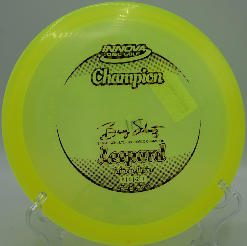 Champion Leopard fairway driver gliding on a long turnover line across fairway at Lake Claiborne State Park Disc Golf Course in Homer, Louisiana