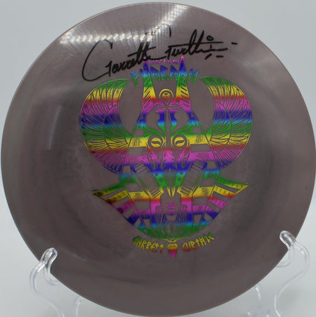 Signed Garrett “GG” Gurthie Swirly S-Blend Pharaoh distance driver ripping a full-power flex bomb at Kaposia Park Disc Golf Course in South St. Paul, Minnesota, carrying massive glide with controlled high-speed turn and a crushing late fade for elite disc golf distance