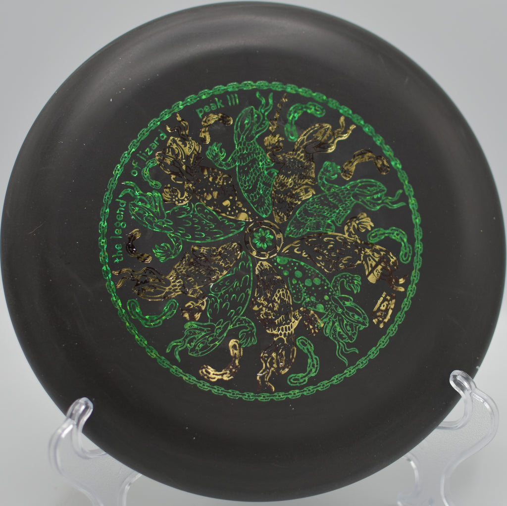 Black DX Aviar in flight over the water hazard at Winthrop Gold Disc Golf Course in Rock Hill, South Carolina.