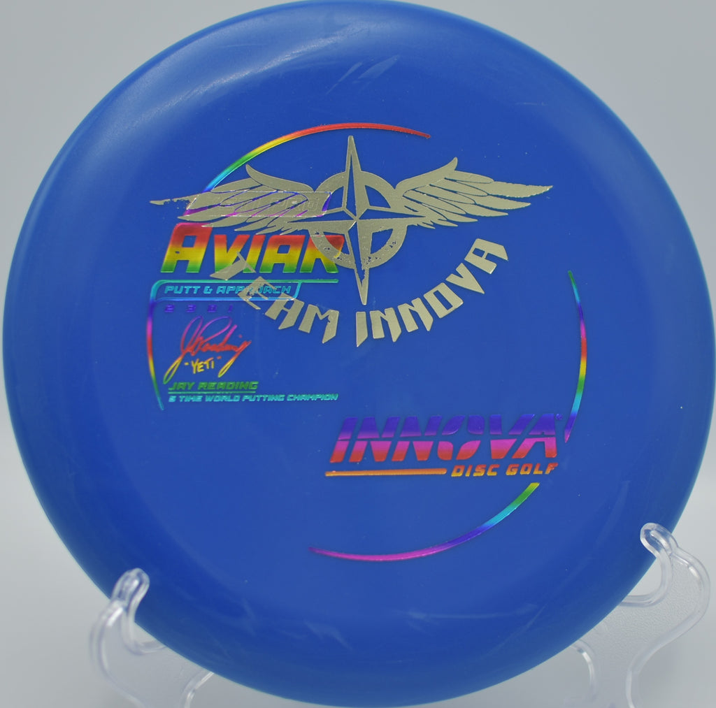 Detailed shot of an Innova Yeti Pro Aviar (Team Stamp) with faint surface wear and mild discoloration, captured at DeLaveaga Disc Golf Course in Santa Cruz, California.