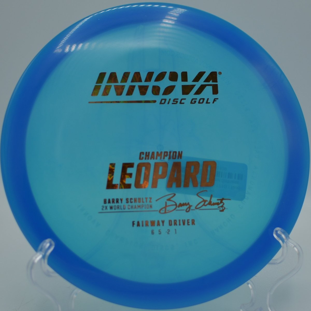 Champion Leopard fairway driver gliding across fairway on a controlled distance shot at Spring Valley Disc Golf Course in Elyria, Ohio