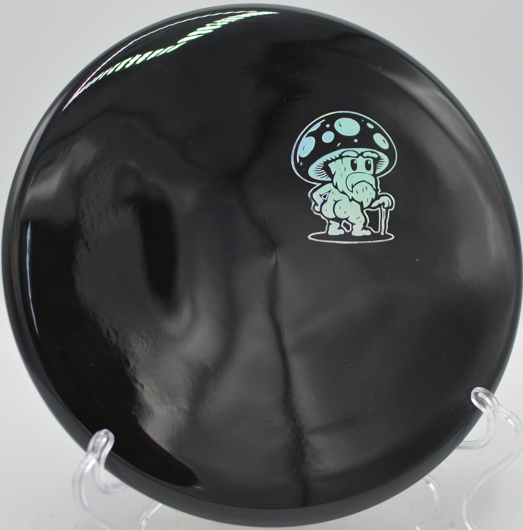 Doomsday Discs Rot Survival beaded putter settling softly at Hornets Nest Disc Golf Course in Charlotte, North Carolina.