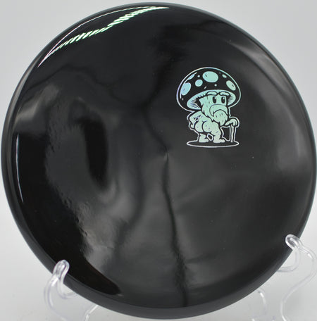 Doomsday Discs Rot Survival beaded putter settling softly at Hornets Nest Disc Golf Course in Charlotte, North Carolina.