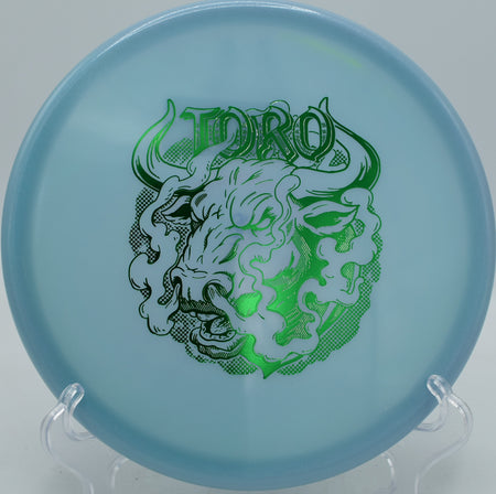 Innova Classic Glow Champion Toro Artist’s Corner torque-resistant putt and approach disc flying clean at Kensington Metropark Disc Golf Course in Milford, Michigan.