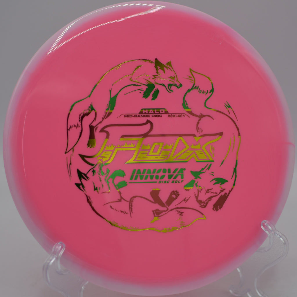 Two-tone Halo Star Fox fairway driver resting on the tee pad at Morley Field Disc Golf Course in San Diego, California.