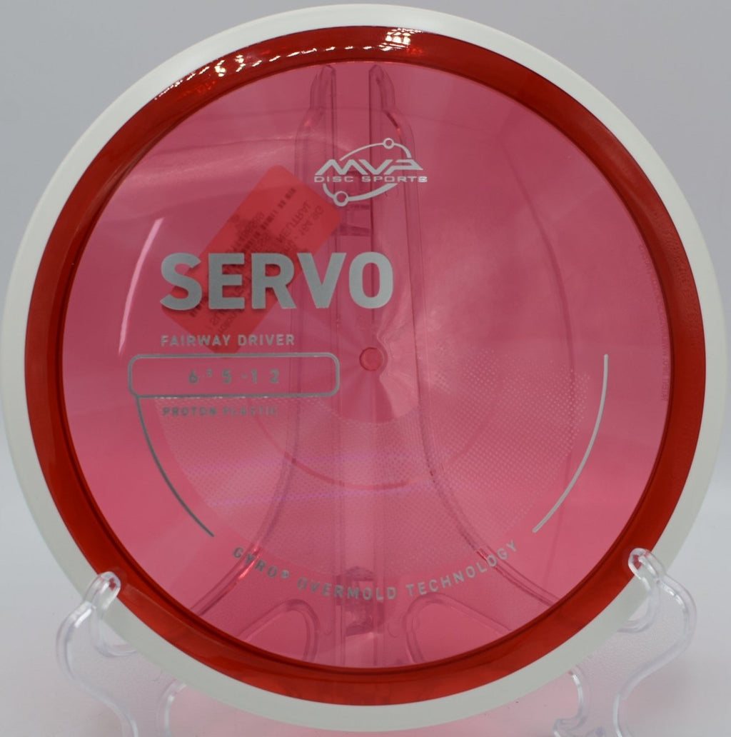 Proton Servo shaping a long turnover at Woodland Valley Disc Golf Course in Limerick, Maine, finishing gently for precision placement