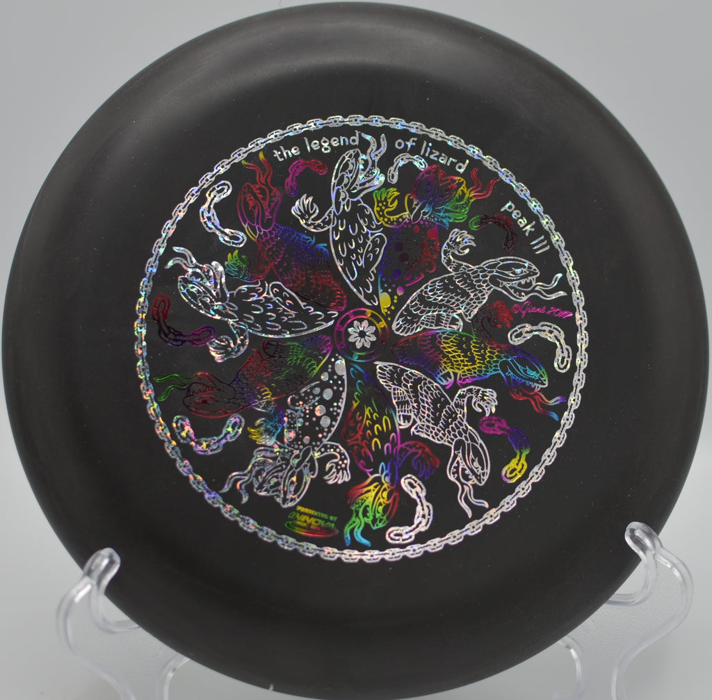 Black DX Aviar spinning flat toward the basket at Milo McIver State Park Disc Golf Course in Estacada, Oregon.