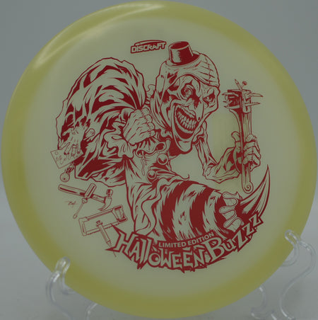 2025 Halloween Single Stamped Mega Glo Buzzz glowing toward the chains at Oxbow Falls Disc Golf Course in Canastota, New York.