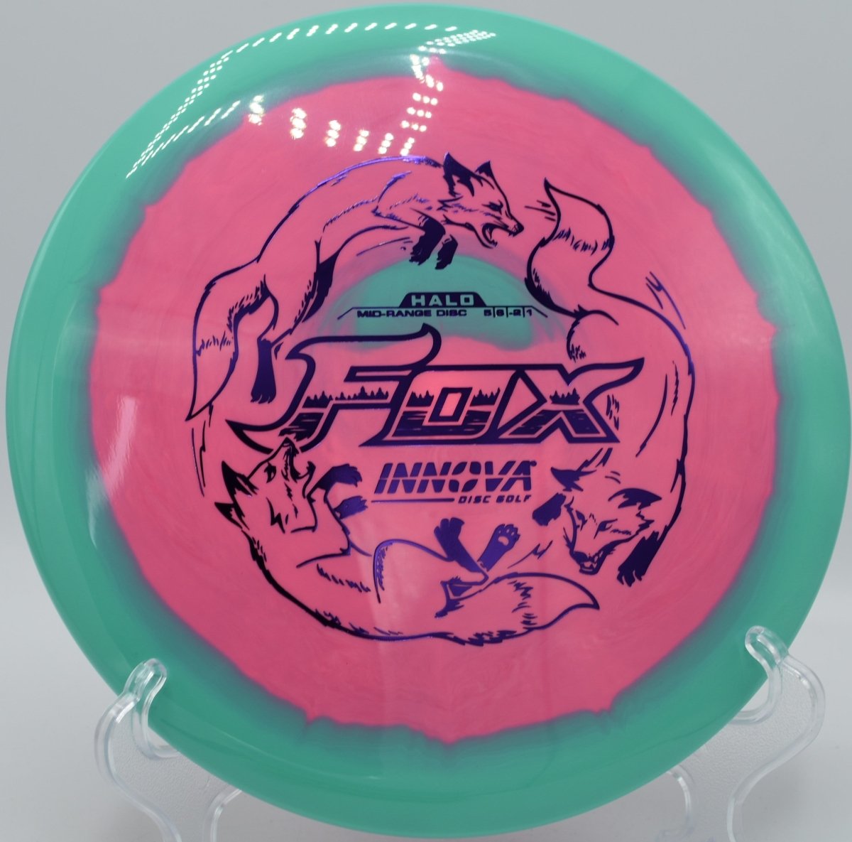 Halo Star Fox fairway driver resting in fairway grass after a controlled turnover shot at The Valley Disc Golf Course in Inverness, Florida