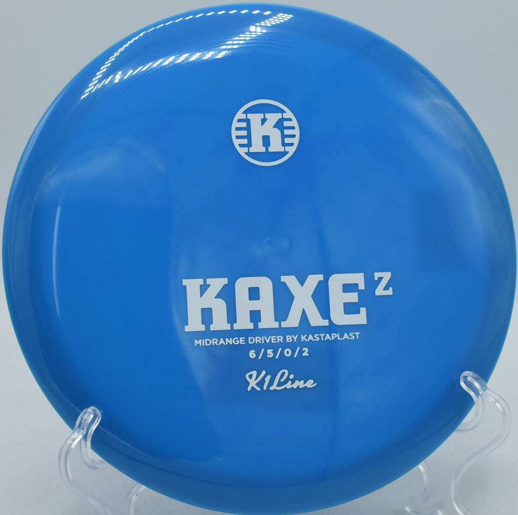 K1 Kaxe Z Kastaplast disc gliding flat with dependable fade at Northwood Black Disc Golf Course in Morton, Illinois.
