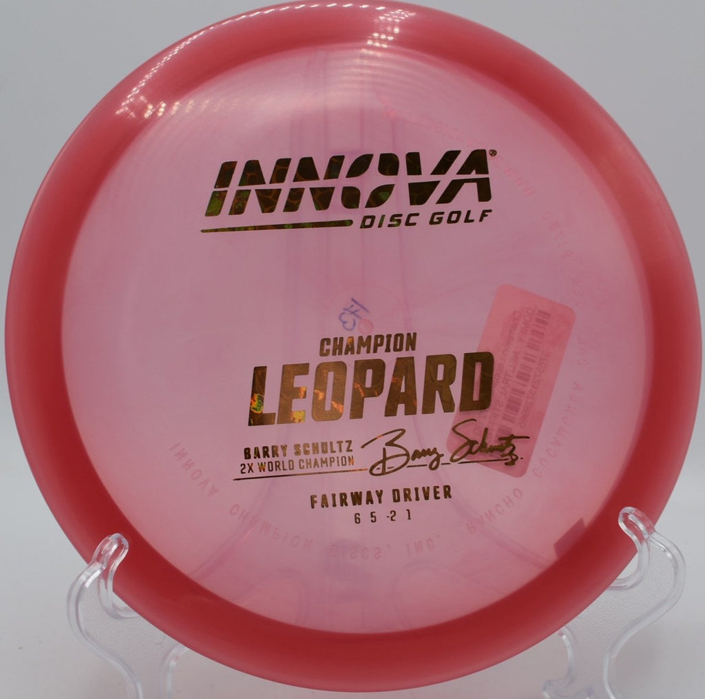 Innova Champion Leopard driver carving a straight control shot through tight gap at Hudson Springs Park Disc Golf Course in Hudson, Ohio
