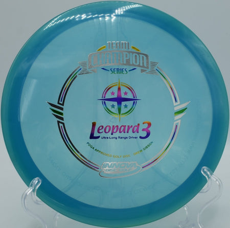 2018 Drew Gibson Luster Leopard3 fairway driver gliding on a clean hyzer-flip at Winthrop Gold Disc Golf Course in Rock Hill, South Carolina, carrying smooth turn, forward glide, and a soft, controlled finish for precision disc golf fairway shots