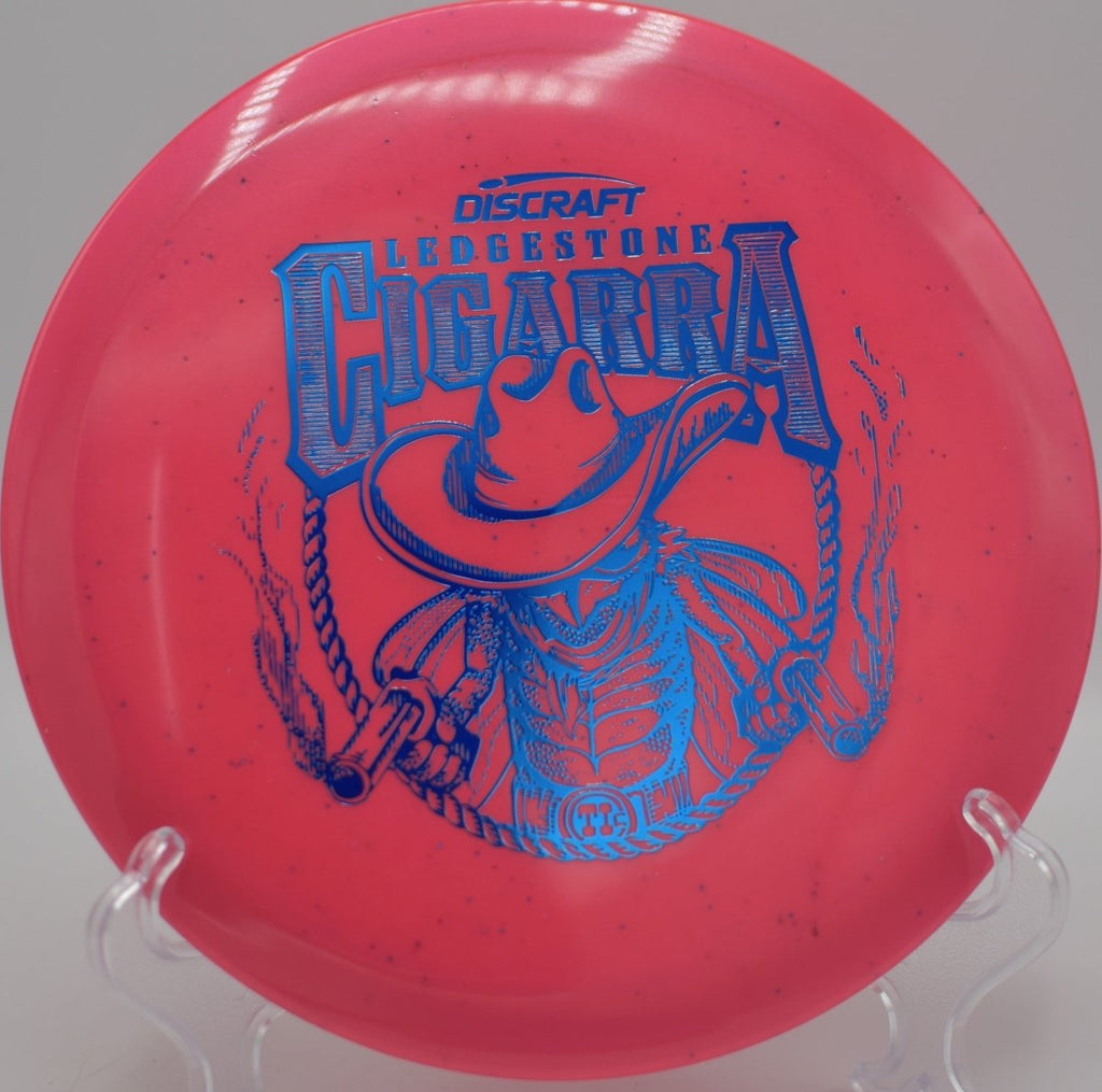 Ti Sparkle Cigarra fairway driver from Discraft finishing cleanly on a wooded par-3 at Hornets Nest Disc Golf Course in Charlotte, North Carolina