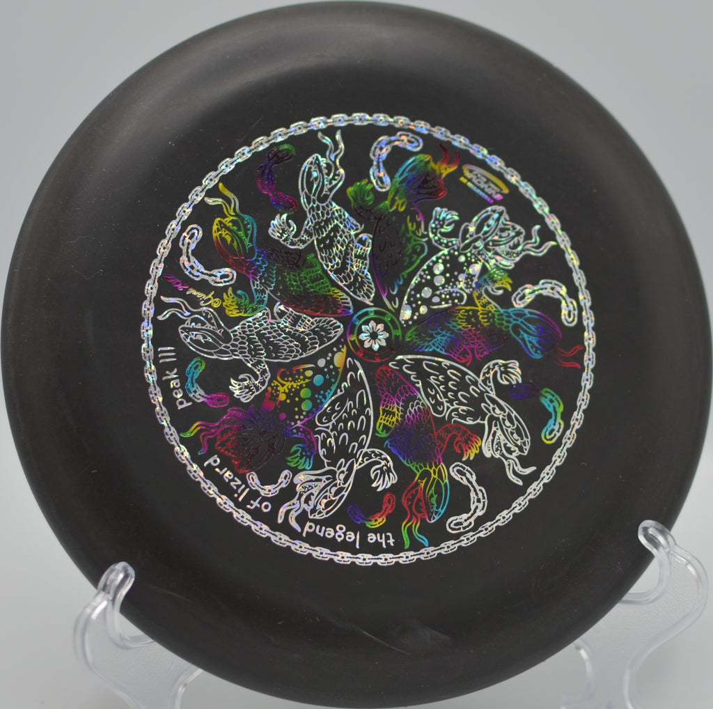 Black DX Aviar settling softly on the green at Blue Ribbon Pines Disc Golf Course in East Bethel, Minnesota.