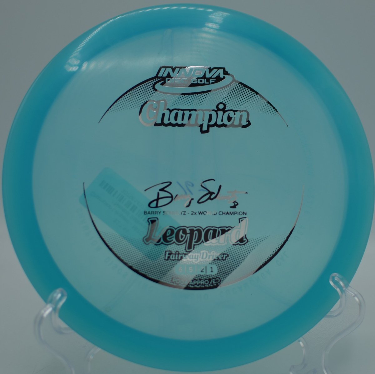 Champion Leopard fairway driver driving a turnover line toward the basket at Heritage Park Disc Golf Course in Belton, Texas