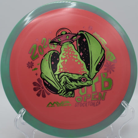 OTB Open 2026 Fission Delirium high-speed driver on wooded fairway at Harmon Hills Disc Golf Course in Fall Branch, Tennessee
