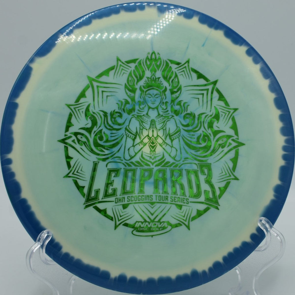 Halo Leopard3 (2021 Ohn Scoggins) fairway driver carving a controlled turnover through tight woods at Selah Ranch Disc Golf Course in Talco, Texas, holding smooth glide, finesse-driven turn, and a gentle finish for precision disc golf placement shots