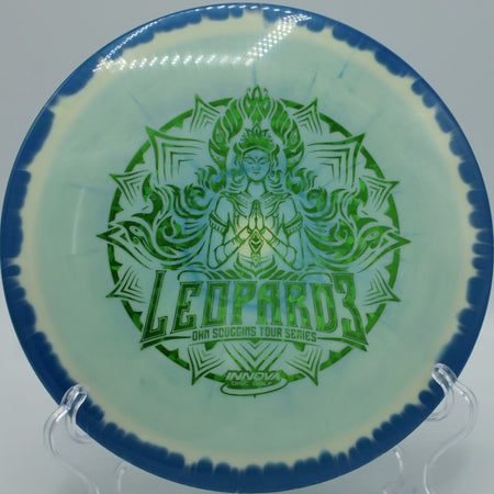 Halo Leopard3 (2021 Ohn Scoggins) fairway driver carving a controlled turnover through tight woods at Selah Ranch Disc Golf Course in Talco, Texas, holding smooth glide, finesse-driven turn, and a gentle finish for precision disc golf placement shots
