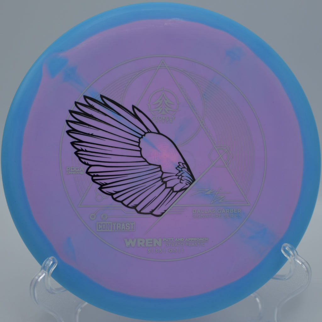 Dallas Garber Strato Wren flying flat through a wooded fairway at Port Royal Disc Golf Course in Clarksville, Tennessee.