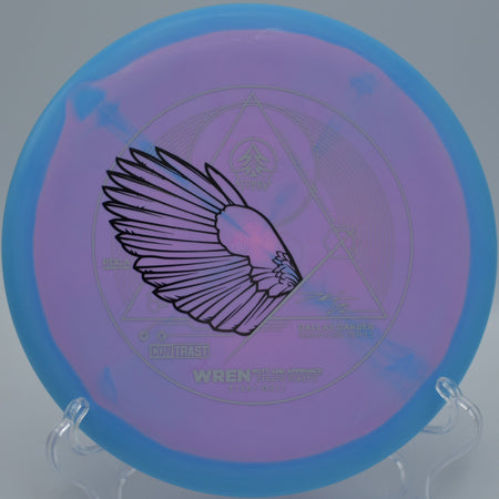 Dallas Garber Strato Wren flying flat through a wooded fairway at Port Royal Disc Golf Course in Clarksville, Tennessee.