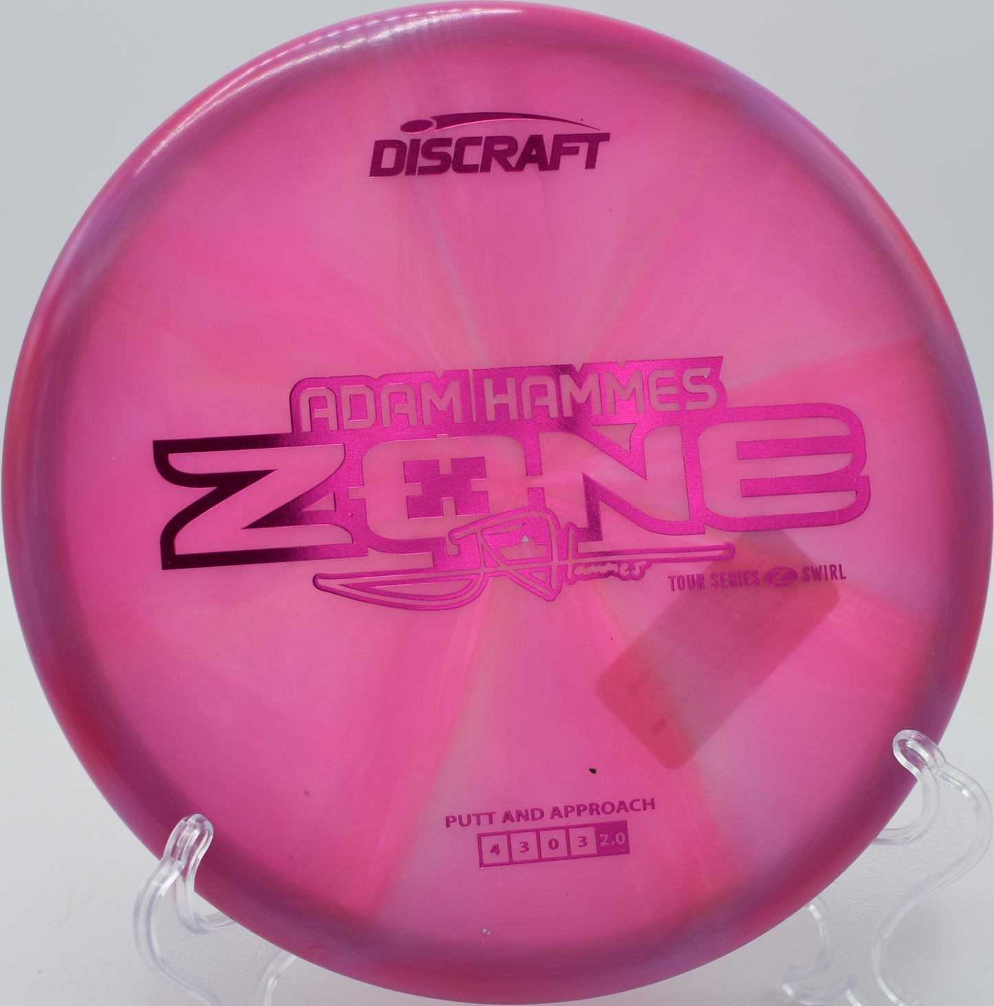 Swirled Z Zone spinning on grass at Brewster Ridge Disc Golf Course in Jeffersonville, Vermont.

