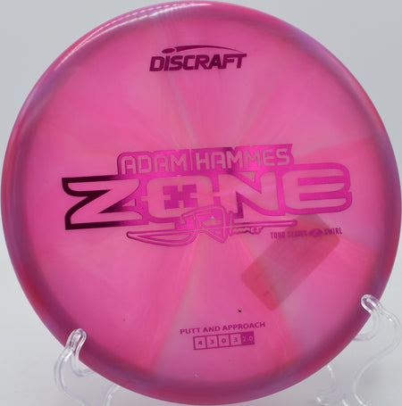 Swirled Z Zone spinning on grass at Brewster Ridge Disc Golf Course in Jeffersonville, Vermont.


