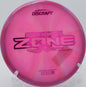 Swirled Z Zone spinning on grass at Brewster Ridge Disc Golf Course in Jeffersonville, Vermont.

