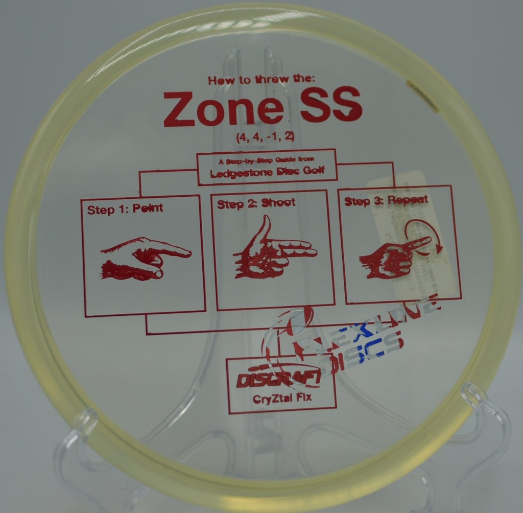 Discraft CryZtal FLX Zone SS approaching softly with minimal ground play at Bad Rock Creek Disc Golf Course in Liberty Lake, Washington