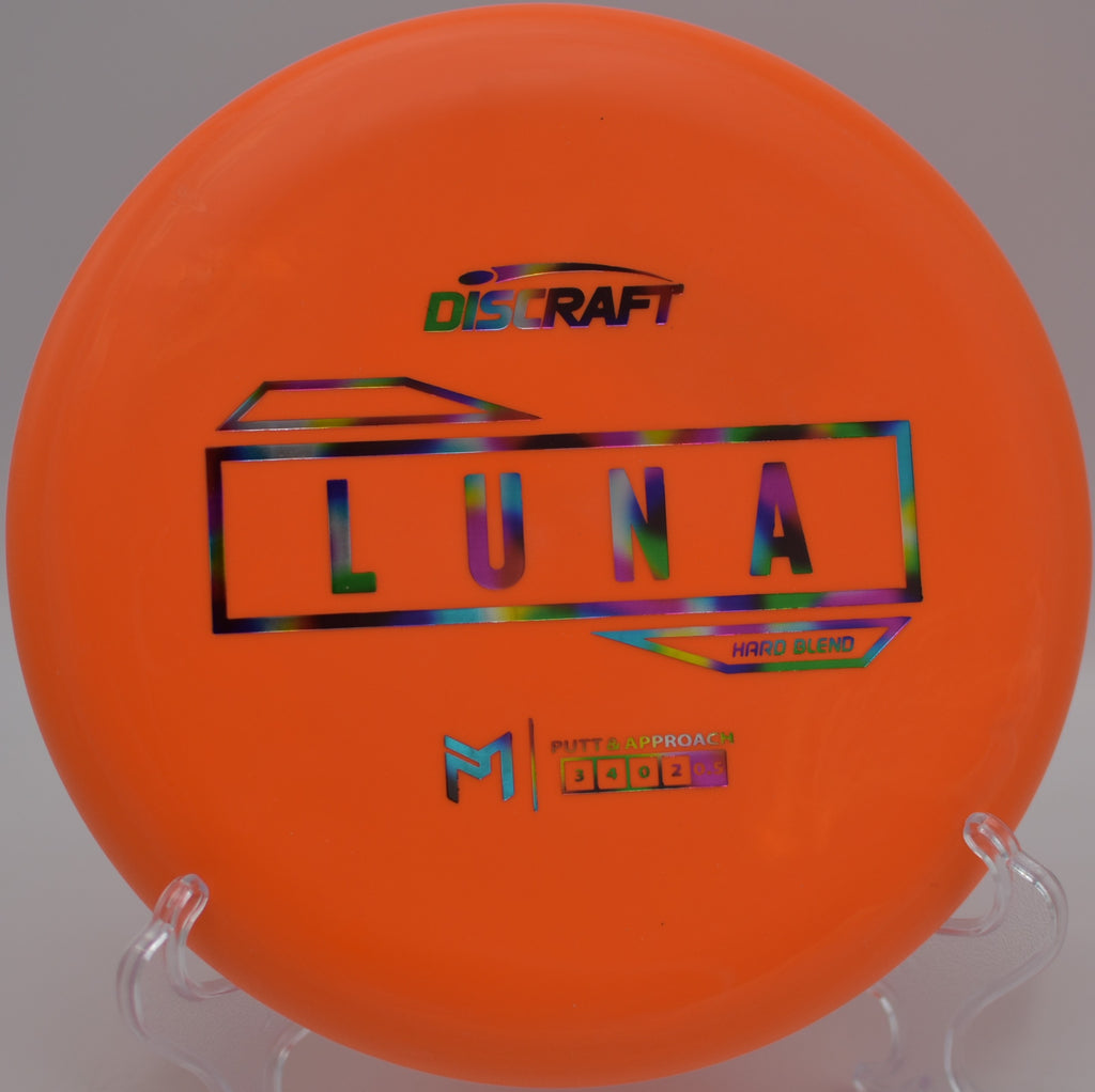 Player gripping the McBeth Hard Blend Luna before a clean release at Riverbend Disc Golf Course in Bend, Oregon.