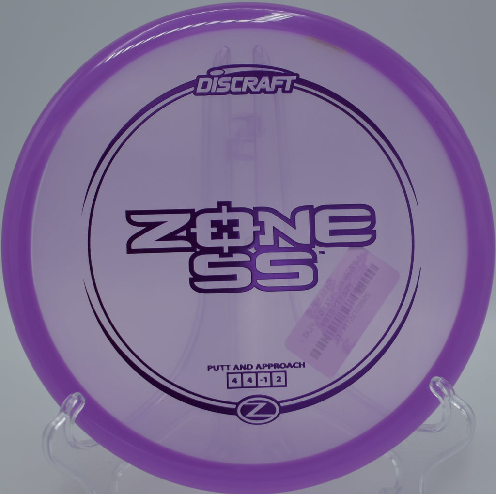 Z Zone SS flying flat and controlled through tree-lined fairways at La Mirada Regional Disc Golf Course in La Mirada, California.