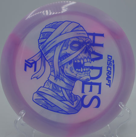 Discraft Mummified Hades streaking past tree gaps on a turnover shot at Idlewild Disc Golf Course in Burlington, Kentucky.