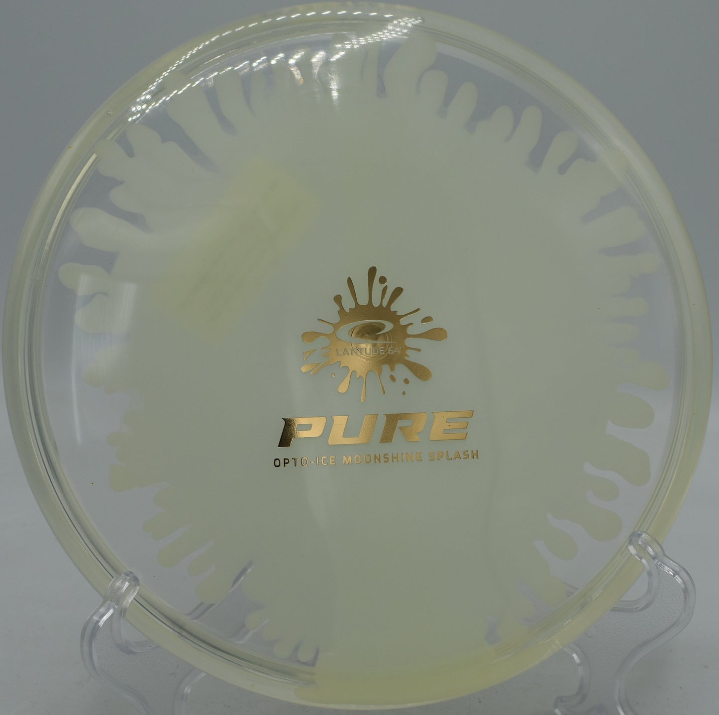 Close-up of Opto-Ice Moonshine Splash Pure with UV glow at Elver Park Disc Golf Course in Madison, Wisconsin
