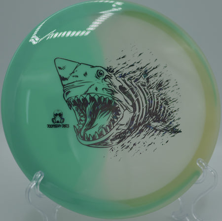 Doomsday Discs Chemtrail in Retina Glow plastic glowing on a hillside tee at Bear Mountain DGC in Chautauqua, OH, ideal for finesse turnovers.