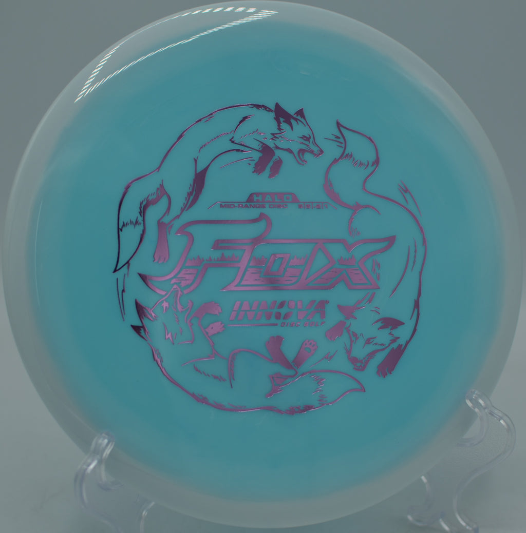 Innova Halo Star Fox streaking across an open fairway at Blue Ribbon Pines Disc Golf Course in East Bethel, Minnesota.