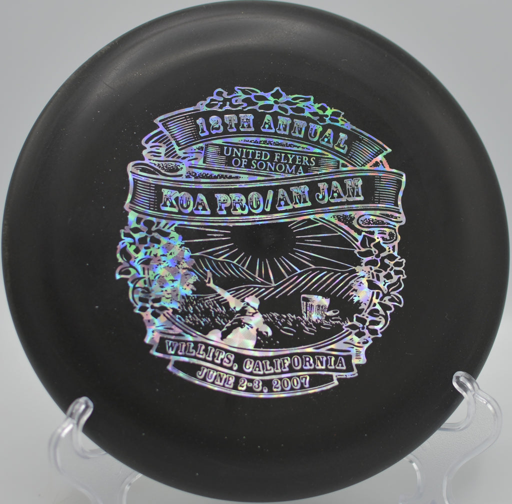 Black DX Aviar hitting chains for birdie at Harmon Hills Disc Golf Course in Fall Branch, Tennessee.