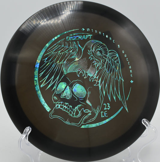 Discraft Midnight Z Vulture fairway driver ripping a controlled flex shot at Northwood Black Disc Golf Course in Morton, Illinois.