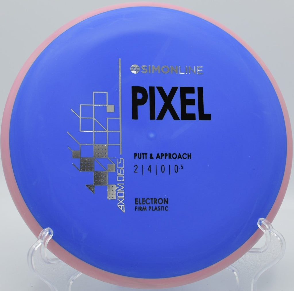 Electron Firm Pixel putter resting on the green after a touch upshot at High Desert Disc Golf Course in Albuquerque, New Mexico