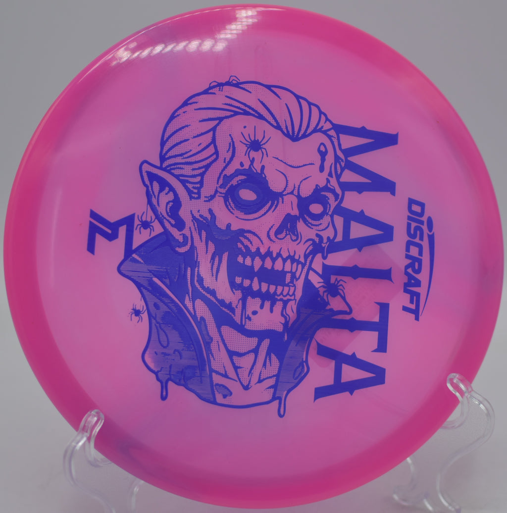 Z Swirl Dracul Malta spinning through humid air on a controlled anhyzer line at Bill Frederick Park Disc Golf Course in Orlando, Florida.