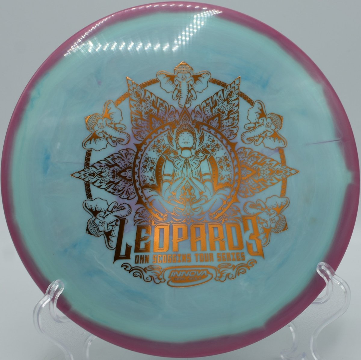 Ohn Scoggins Halo Leopard3 – 2022 Tour Series fairway driver pushing a smooth hyzer-flip through wooded lanes at Moraine State Park Disc Golf Course in Portersville, Pennsylvania, carrying effortless glide, workable turn, and a gentle finishing fade for precision disc golf control