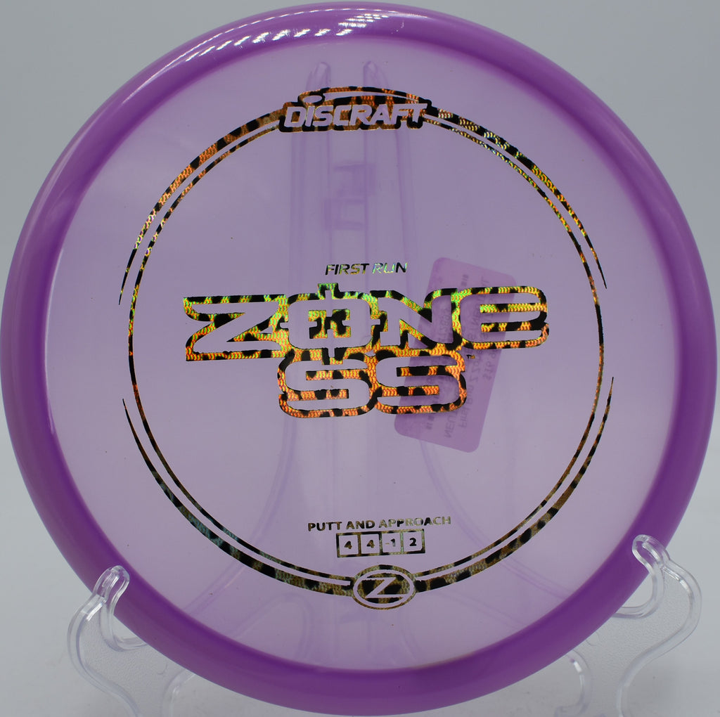 Discraft First Run Z Zone SS finessing tight line at Oggwood Disc Golf Course in TN